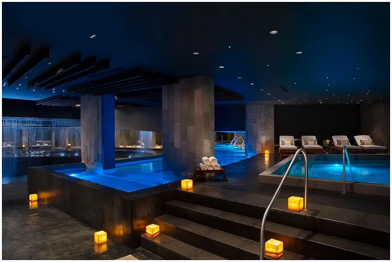 Serene resort spa with a captivating central water feature.