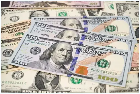 Vintage US currency collection with $100, $500, and $1000 bills.