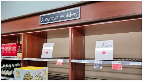 Bottles of various liquor on shelves in a government-run store.